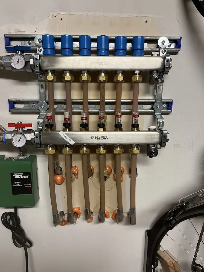 Plumber performing Water Heater Repair at a residential property in Amwell